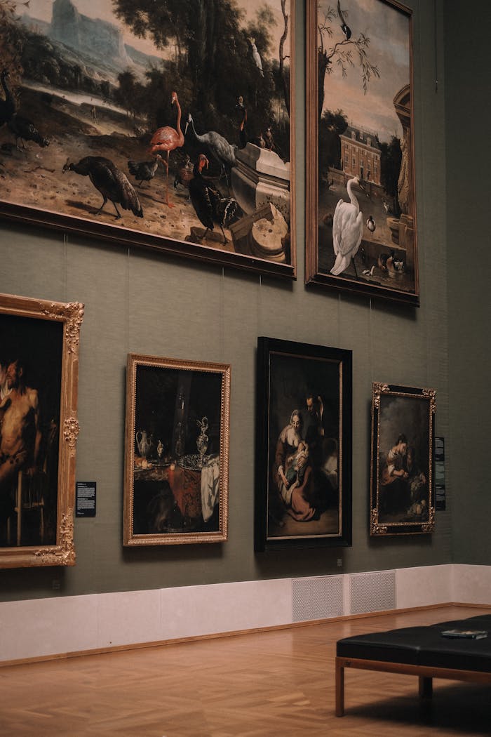 About Elegant art gallery interior with classic paintings on green walls in Munich, Germany.